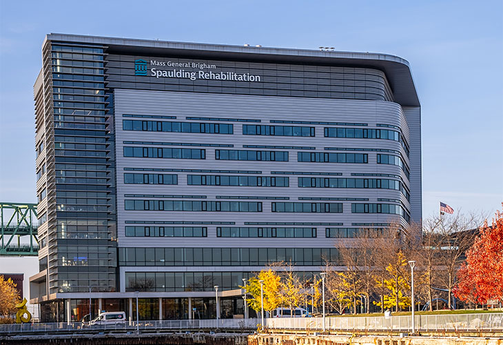 A Spaulding Rehabilitation building surrounded by fall trees.