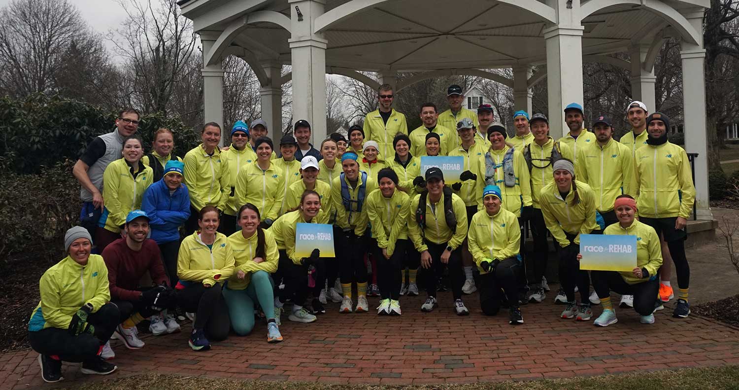 People in yellow team jackets at the Race for Rehab.