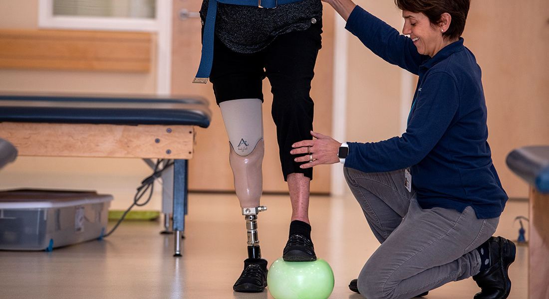 Patient with prosthetic leg rehabbing at Spaulding Rehabilitation Hospital Cape Cod