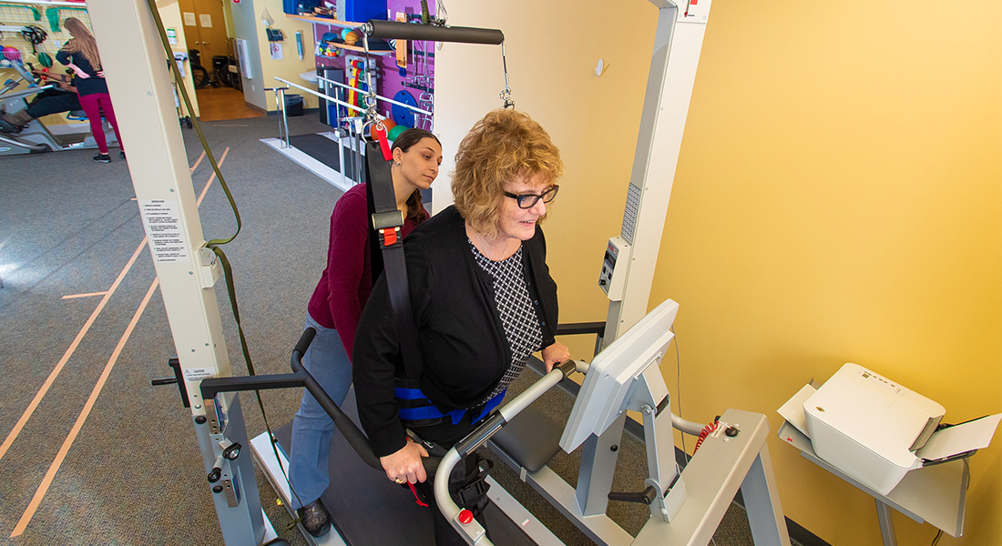 Physical therapist helping patient rehab at Spaulding Outpatient Center Medford