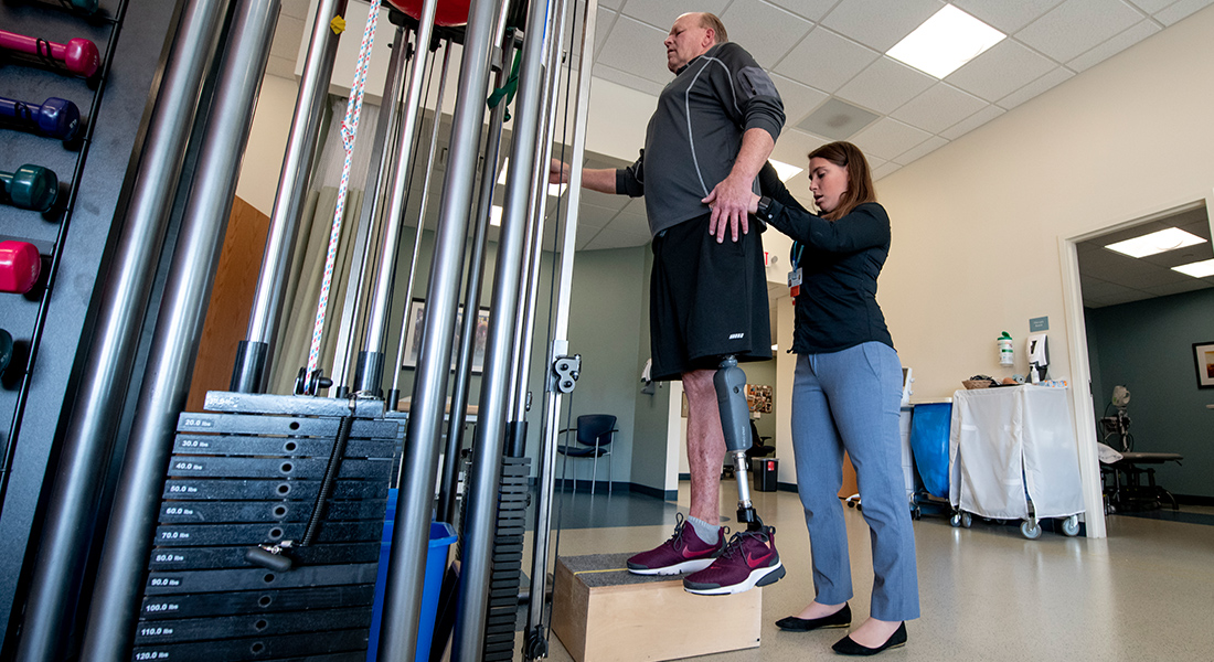 Patient with prosthetic leg rehabbing at Spaulding Outpatient Center South Shore YMCA Quincy