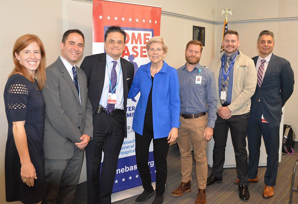 Senator Warren poses with the other panelists.