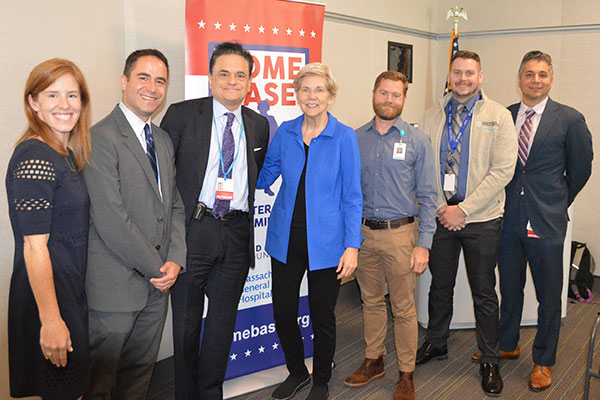 Senator Warren poses with members of Spaulding and the Home Base Program.