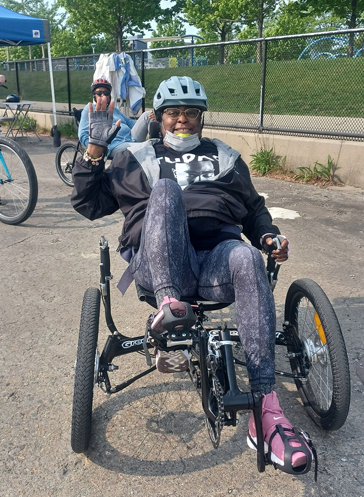 Lisa on a reclining adaptive bicycle.