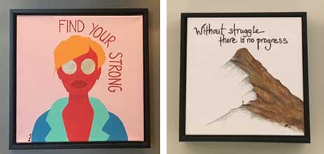 Lizzy's paintings. One is a painting of a woman with the words "Find your strong." The other is a mountaintop with the words "Without struggle there is no progress."