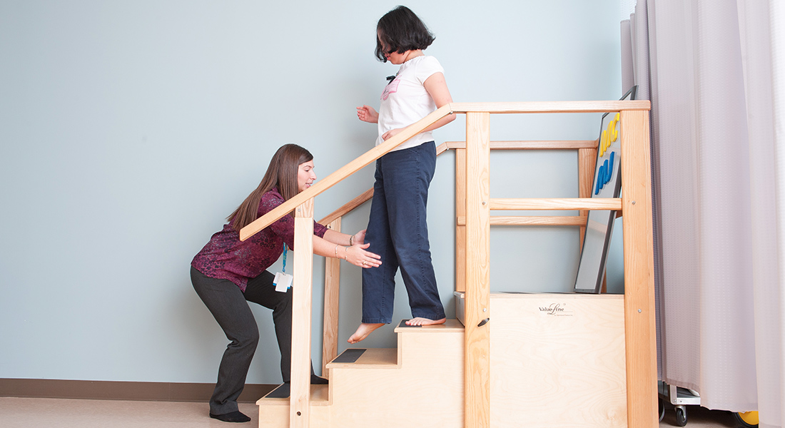 pediatric patient rehabbing by climbing stairs
