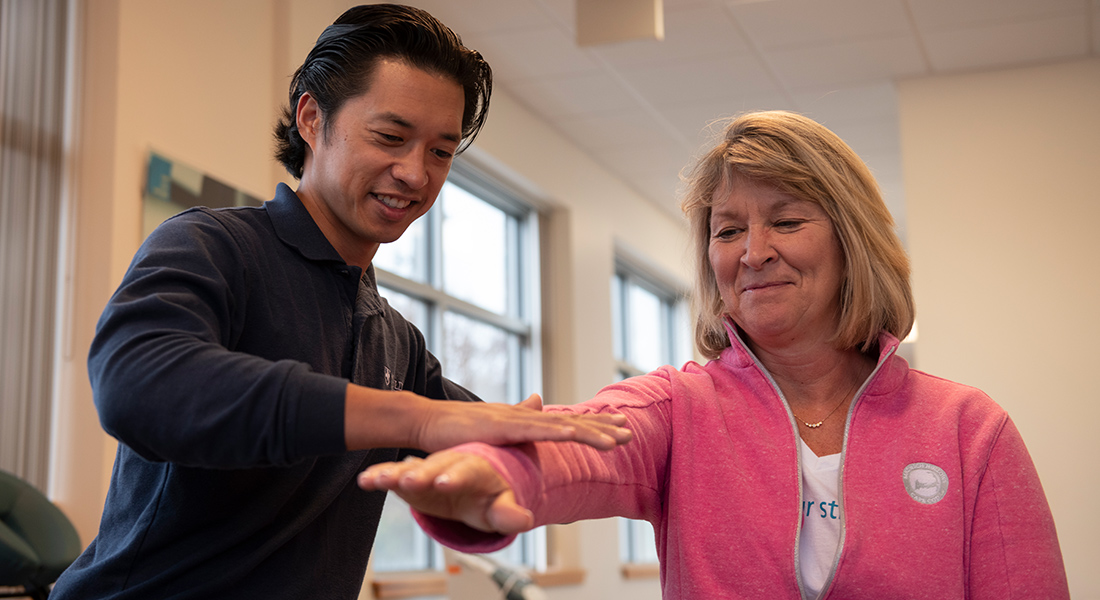 Physical therapist rehabbing patient at Spaulding Outpatient Center Plymouth